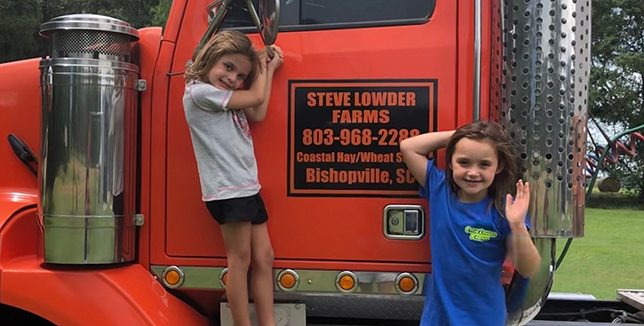 Little girls on a truck